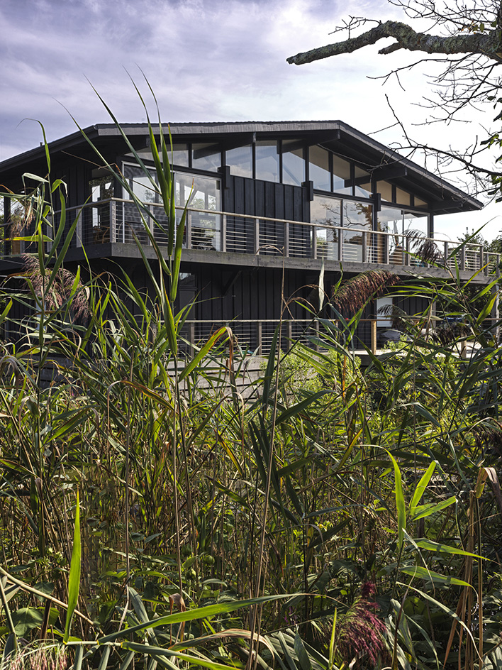 Fire Island tour of house in the pines, timber structure and pool ad warm interiors