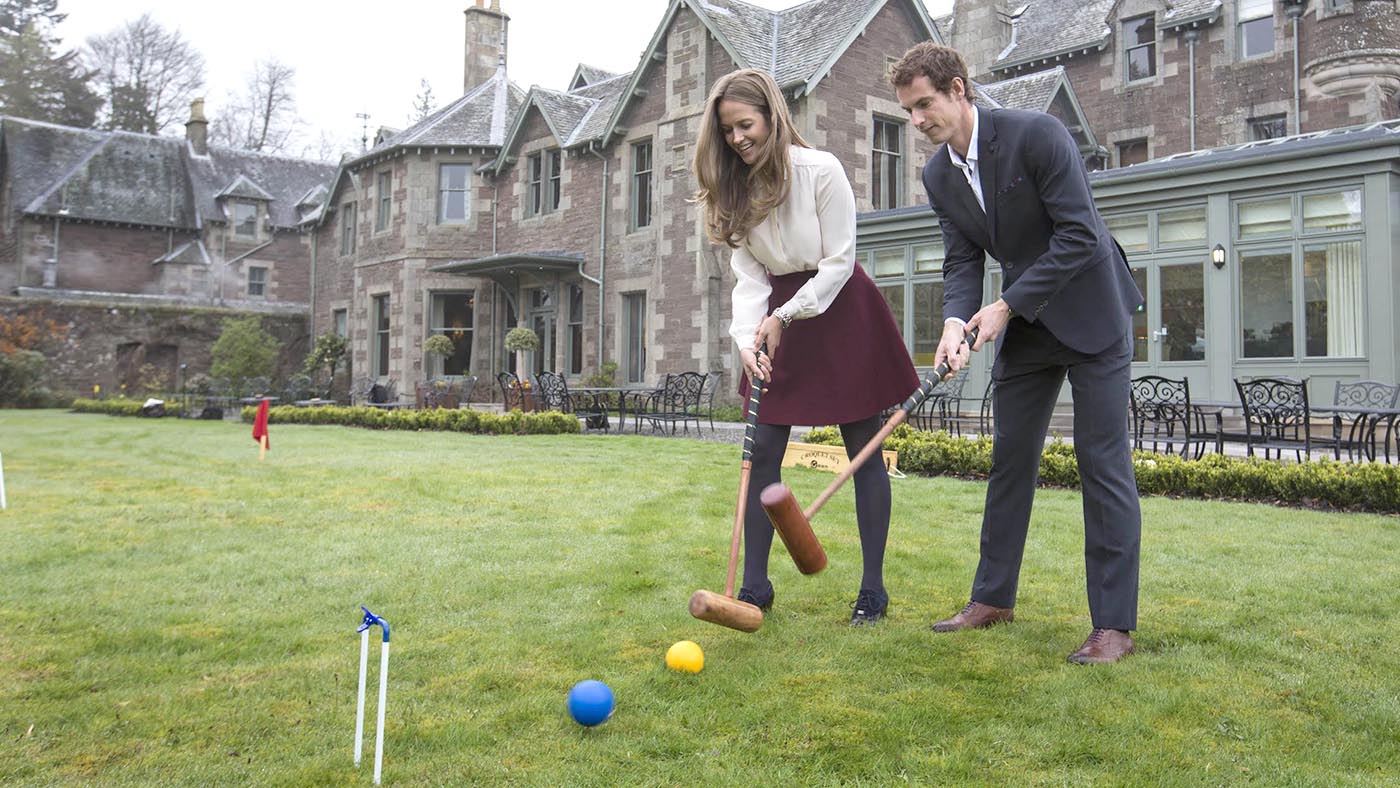 Kim and Andy play croquet on the lawn in front of Cromlix hotel near Dunblane.