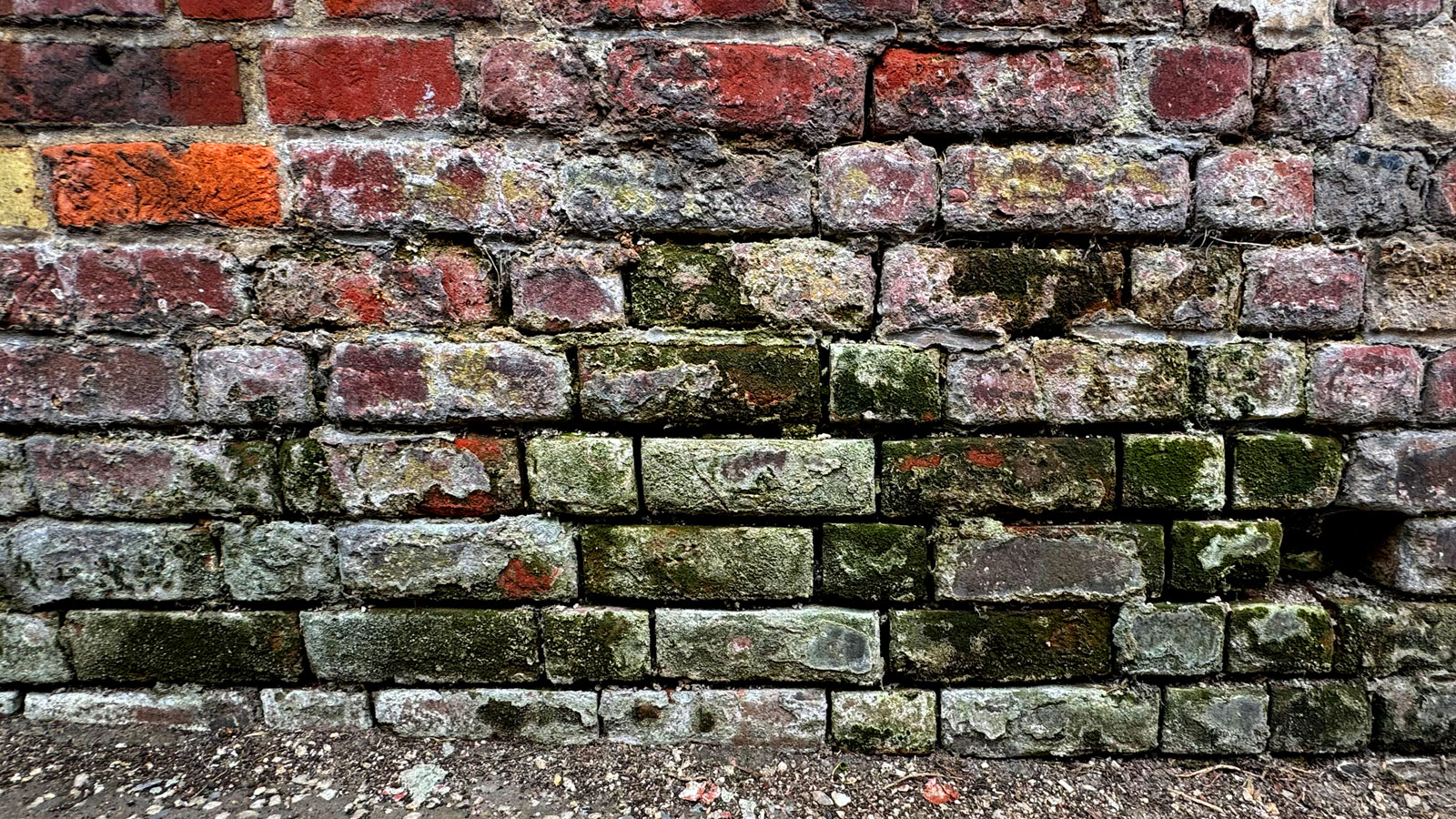 Mouldy and old brick wall
