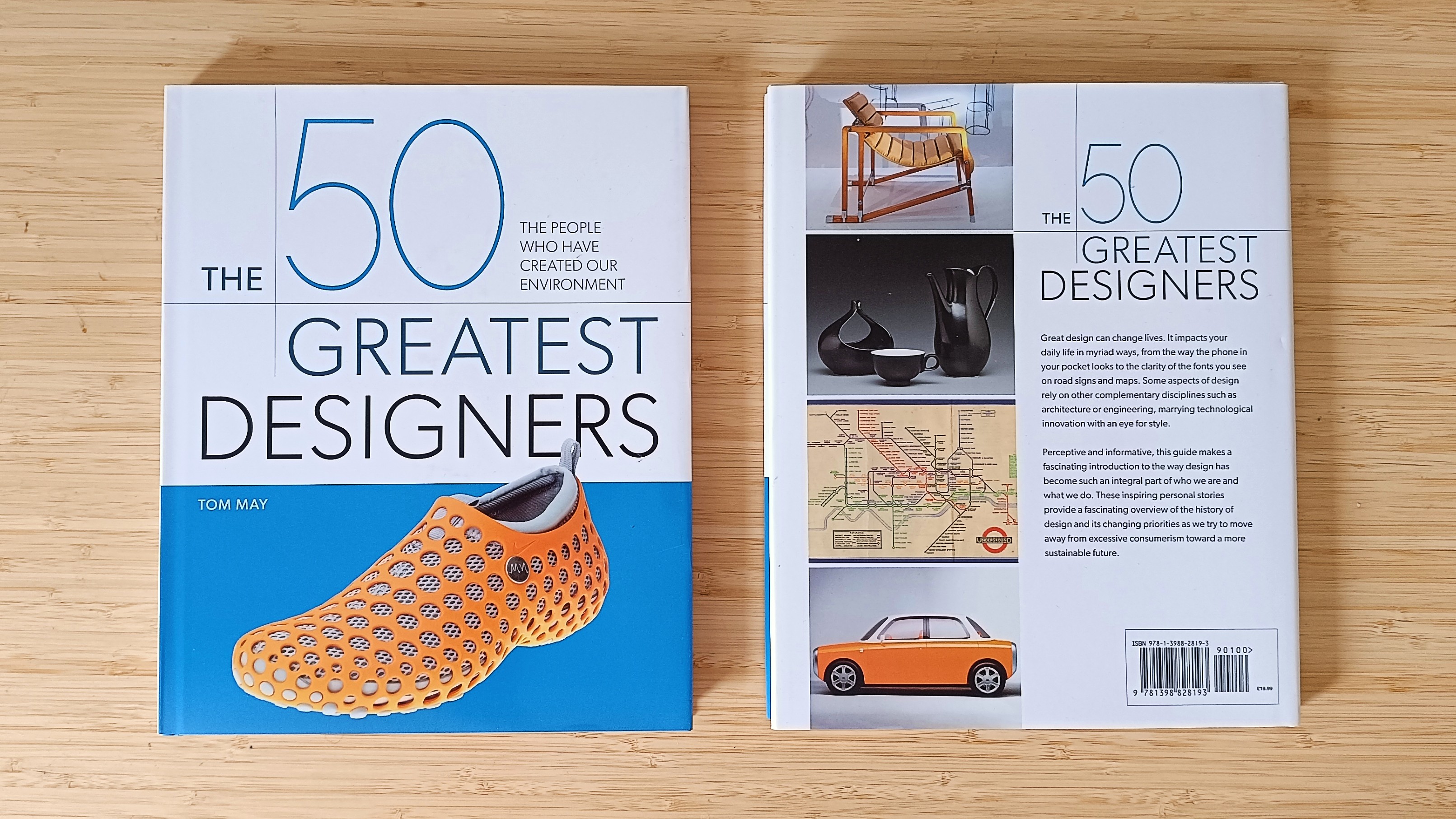 Front and back of the book 50 Greatest Designers on a wooden desk