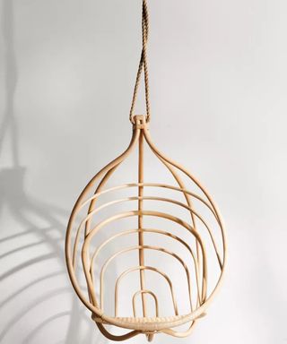 A rattan and manila rope egg chair by Urban Outfitters