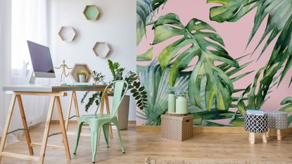 pink tropical feature wall in study with wooden floor and desk 