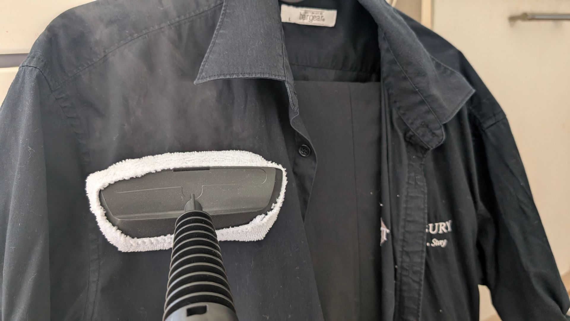 Testing the Beldray 15-in-1 Steam Cleaner steaming clothes