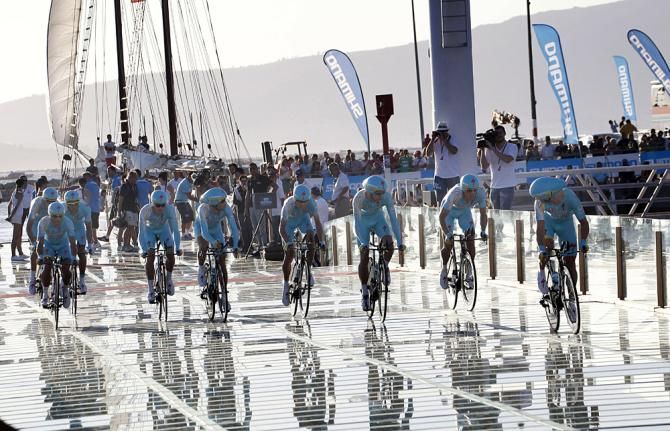The Astana team was deposited on the ramp by boat, riding across the see-through platform