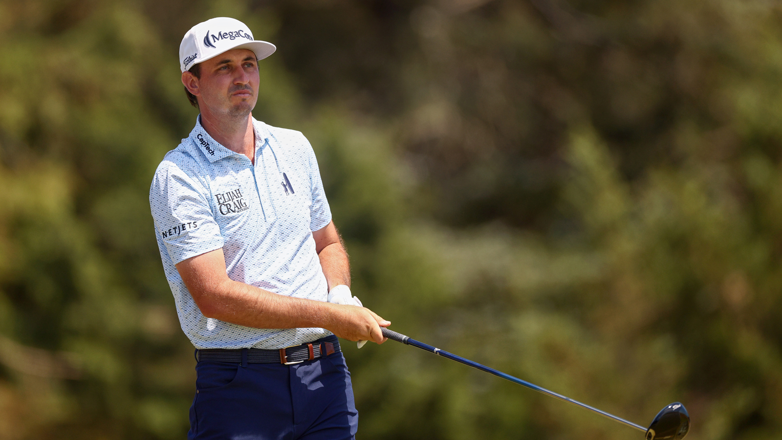 JT Poston hits a driver off the tee