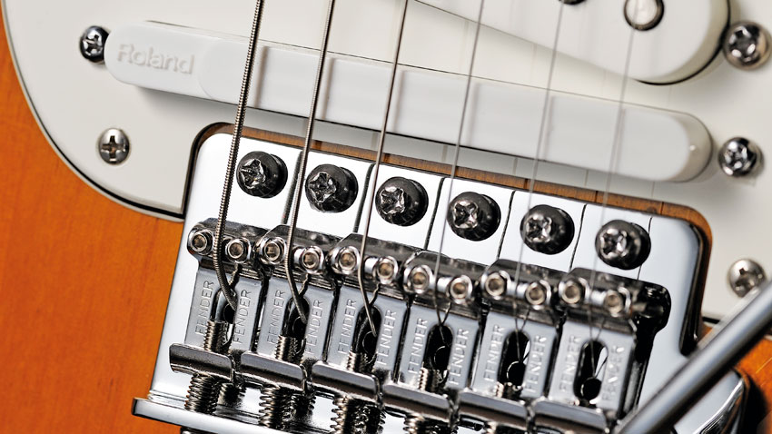 Between the bridge pickup and the vibrato is a GK-style hexaphonic pickup, which passes the string information into the digital realm to voice the Roland COSM technology