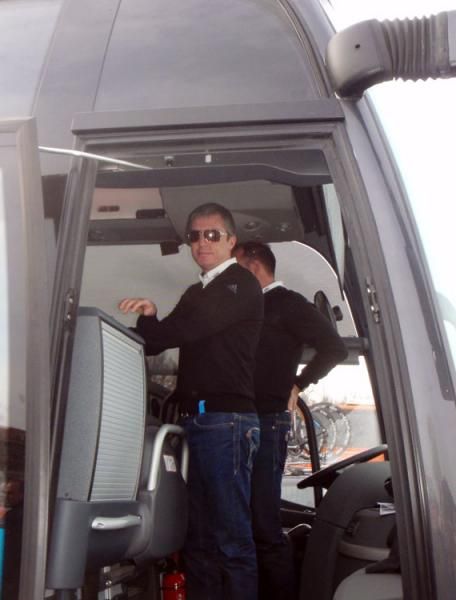 Team Sky executive directeur sportif Scott Sunderland makes sure everything runs smoothly aboard the team bus at the start