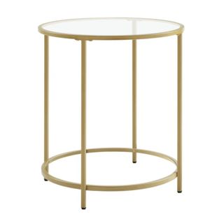 A glass table with gold legs