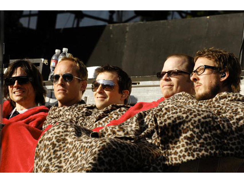 Weezer get snuggly with Josh Freese (second from left)