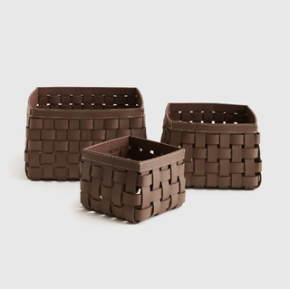 Woven leather storage basket.