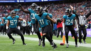 Parker Washington of Jacksonville Jaguars celebrates scoring a touch down with teammates during the NFL match between New England Patriots and Jacksonville Jaguars at Wembley Stadium on October 20, 2024 in London, England.