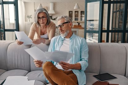 Older couple looking at bills