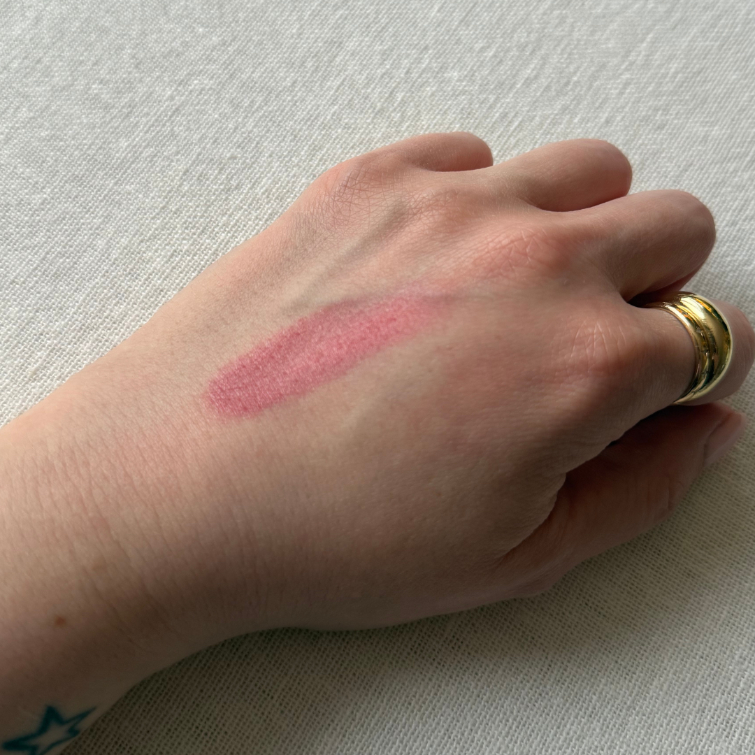 Swatch of Merit Beauty Flush Balm on the back of a hand