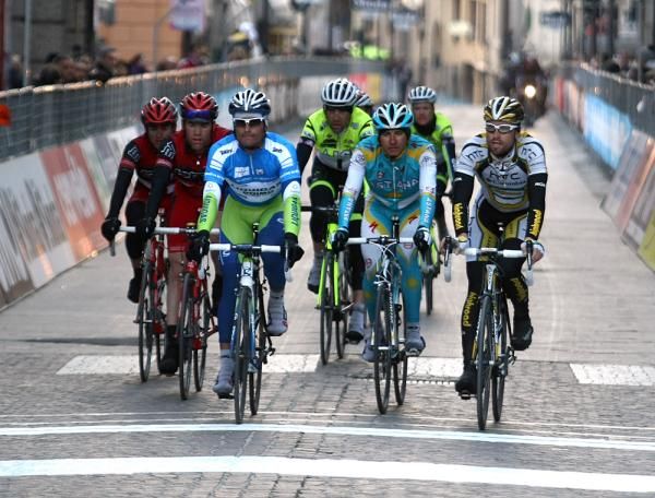 The group of previous race leader Daniele Bennati comes across the line.