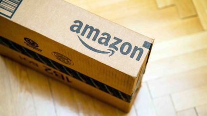 An Amazon delivery box amzn stock amazon stock
