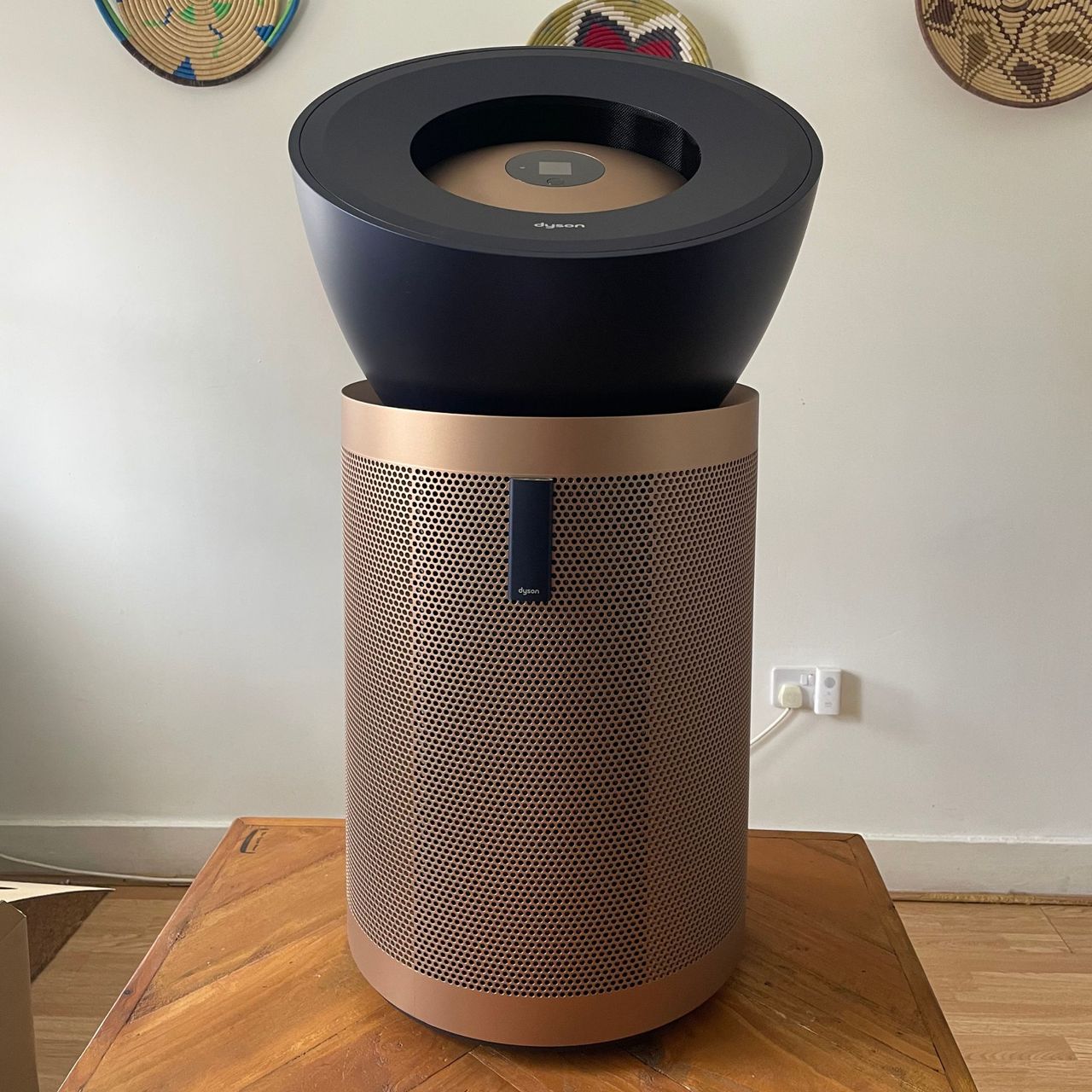Dyson Purifier Big+Quiet Formaldehyde sitting on a wooden table in front of a white wall
