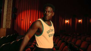 Kashus Culpepper standing in a row of cinema seats