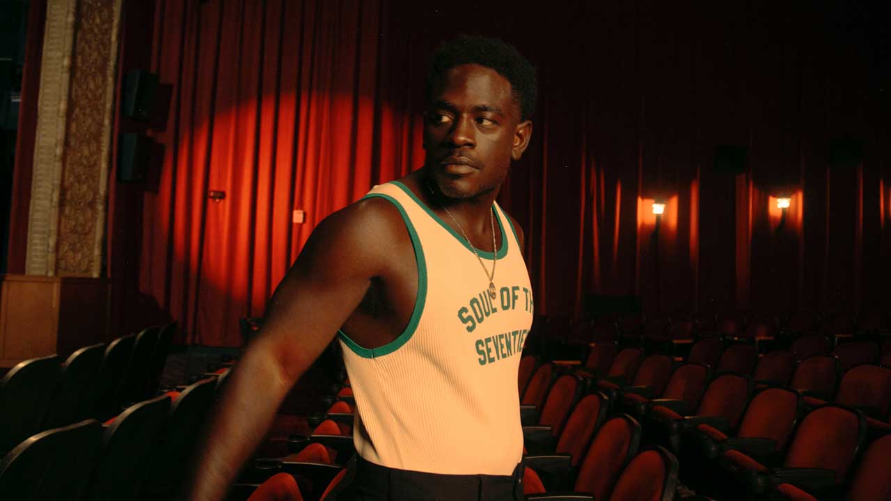 Kashus Culpepper standing in a row of cinema seats