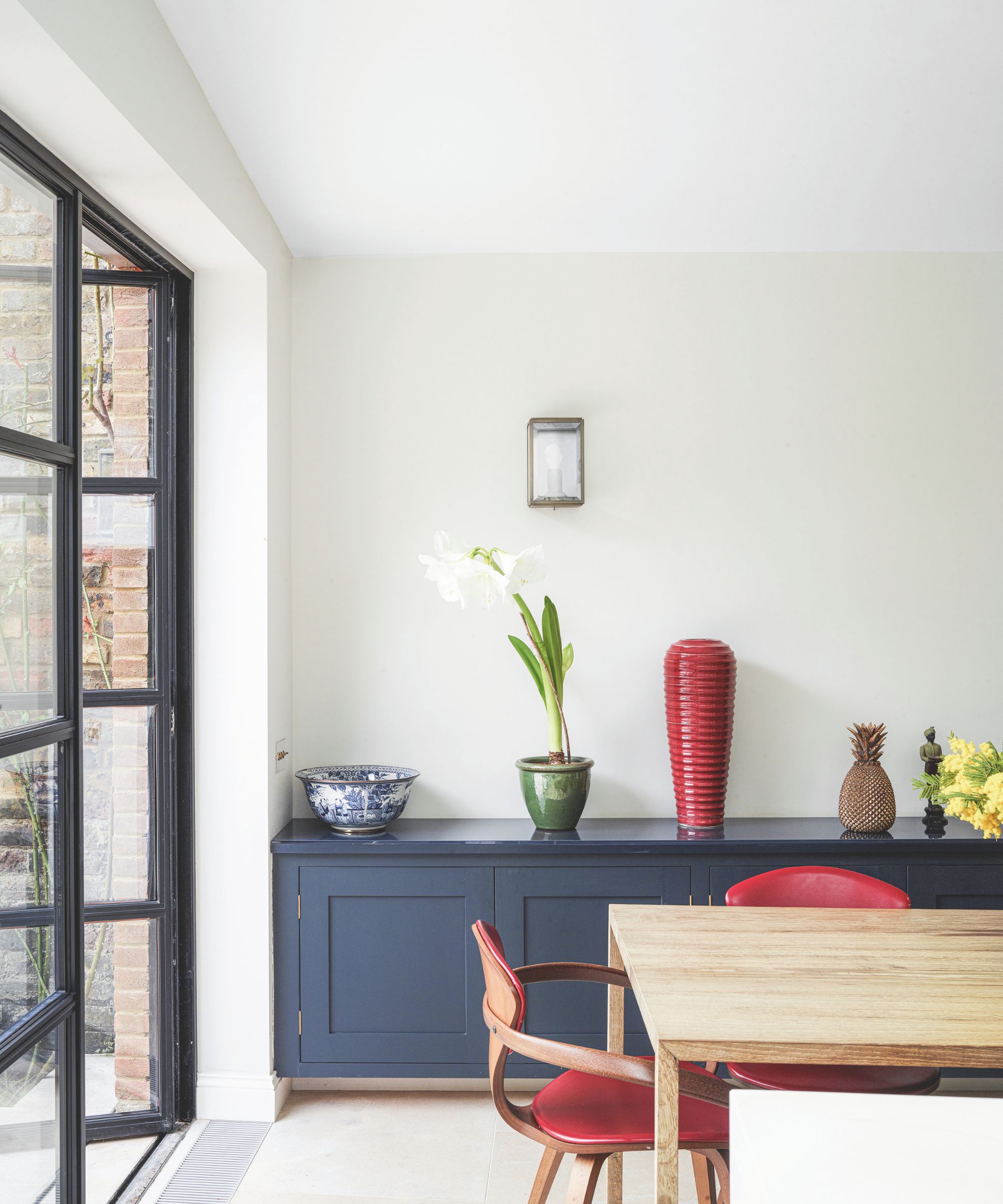 dining room with French door and red accents