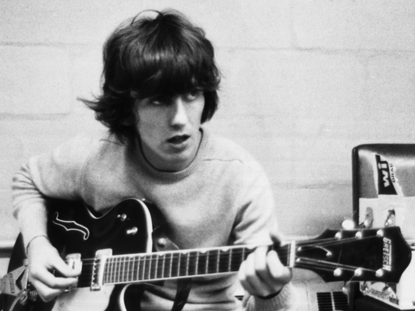 George Harrison backstage before a Beatles show in 1965.