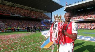 LONDON, ENGLAND - MAY 15: Patrick Vieira of Arsenal with Premier League Trophy after the Premier League match between Arsenal and Leicester City on May 15, 2004 Arsenal Stadium, Highbury in London, England. (Photo by Stuart MacFarlane/Arsenal FC via Getty Images)
