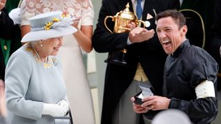 ASCOT, UNITED KINGDOM - JUNE 20: (EMBARGOED FOR PUBLICATION IN UK NEWSPAPERS UNTIL 24 HOURS AFTER CREATE DATE AND TIME) Queen Elizabeth II presents jockey Frankie Dettori with his prize after he rode 'Stradivarius' to victory in the Gold Cup on day three, Ladies Day, of Royal Ascot at Ascot Racecourse on June 20, 2019 in Ascot, England.