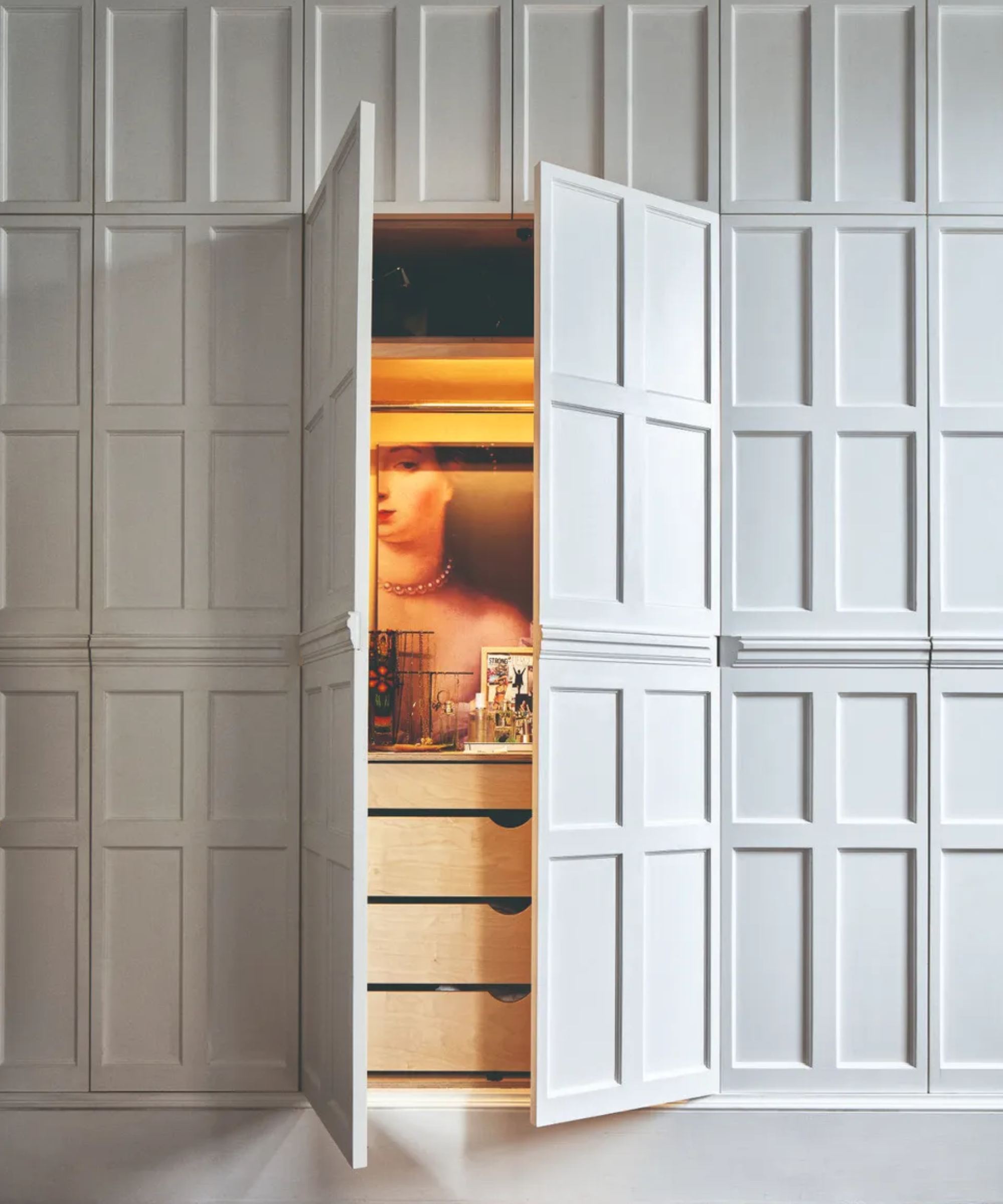 door with dresser behind