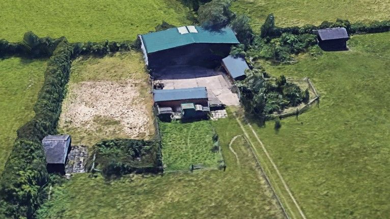 A barn and house in the countryside