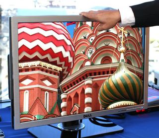 You only need two fingers to raise and lower the monitor panel. Notice that the picture quality on the monitor is so good that it almost looks fake. Click here to see the 1024-pixel wide image.