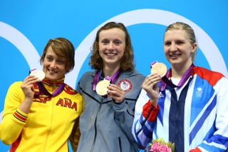 Silver medallist Mireia Belmonte Garcia of Spain, gold medallist Katie Ledecky of the United States, and bronze medallist Rebecca Adlington of Great Britain