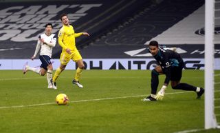 Tottenham striker Son Heung-min watches as his shot goes past a post