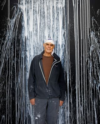 Richard Long in front of white water falls