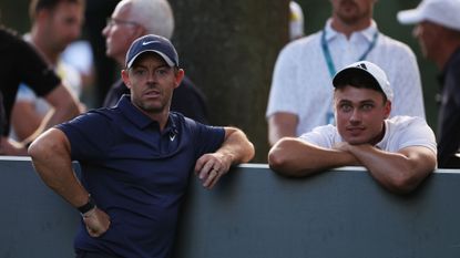 Rory McIlroy of Northern Ireland and Ludvig Aberg of Sweden wait on the 17th tee on Day Two of the BMW PGA Championship