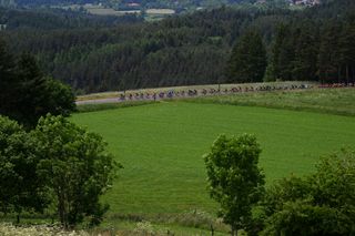 The peloton during the mid-race phase of stage 3 of the 2023 Criterium du Dauphine