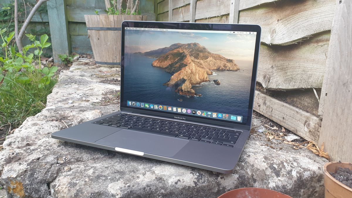 apple-macbook-pro-on-bed-free-mockup