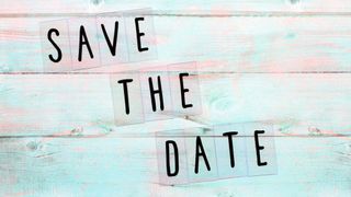 Save the date on a blue wooden background in a wedding font
