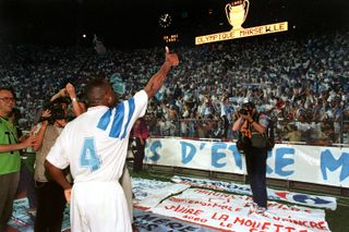 Basile Boli celebrates after Marseille's Champions League final win over AC Milan, in which he scored the game's only goal, in May 1993.