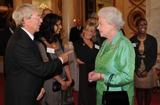 Queen Elizabeth II receiving Blue Peter presenter John Noakes