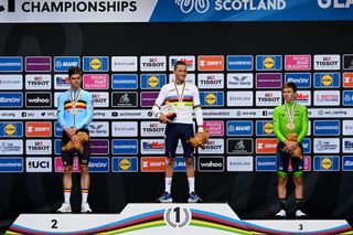 GLASGOW SCOTLAND AUGUST 06 LR Silver medalist Wout Van Aert of Belgium gold medalist Mathieu Van Der Poel of The Netherlands and bronze medalist Tadej Pogacar of Slovenia pose on the podium during the medal ceremony after the 96th UCI Cycling World Championships Glasgow 2023 Men Elite Road Race a 2711km one day race from Edinburgh to Glasgow UCIWT on August 06 2023 in Glasgow Scotland Photo by Dario BelingheriGetty Images