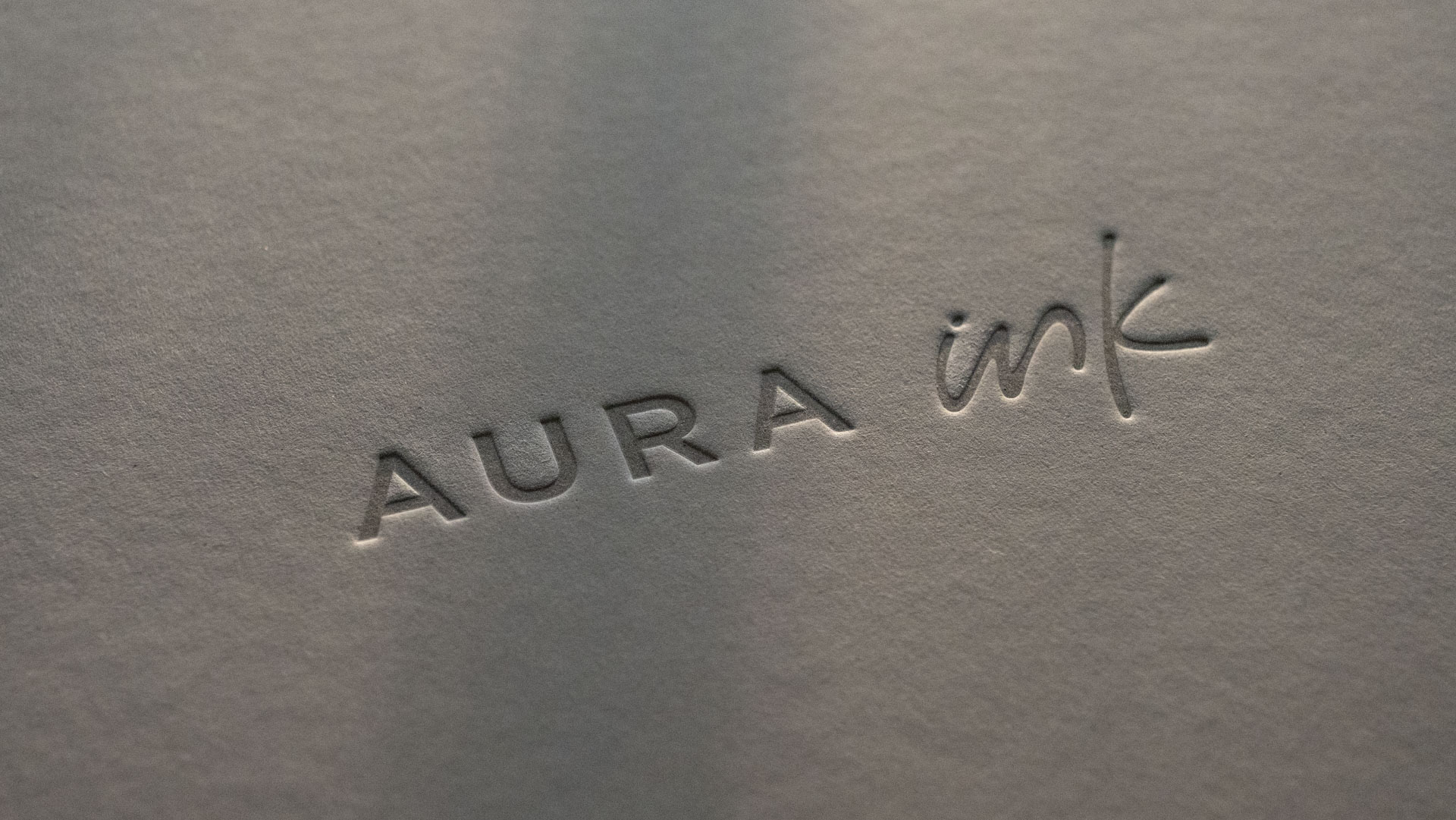 The close up of the Aura Ink 'E Ink' digital photo frame's presentation box, illuminated by the golden hour sun