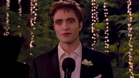 Robert Pattinson as Edward Cullen making a wedding speech to Bella Swan in Twilight: Breaking Dawn Part 1