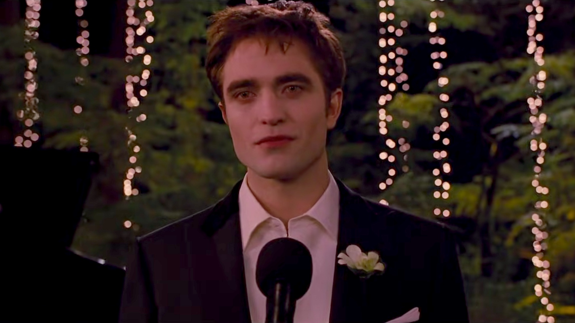 Robert Pattinson as Edward Cullen making a wedding speech to Bella Swan in Twilight: Breaking Dawn Part 1