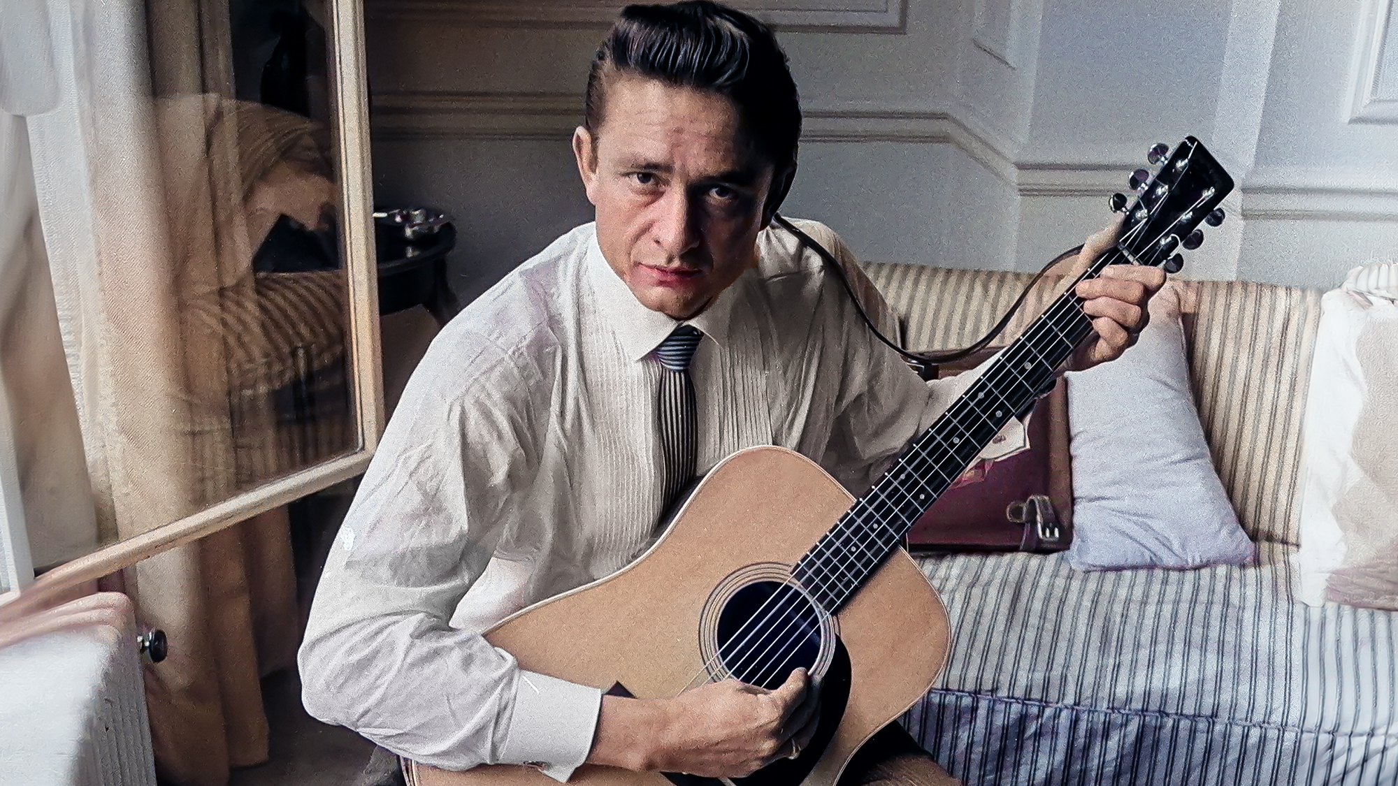 American country singer and musician Johnny Cash poses for photographers at the Savoy Hotel in London. 17th September 1959.