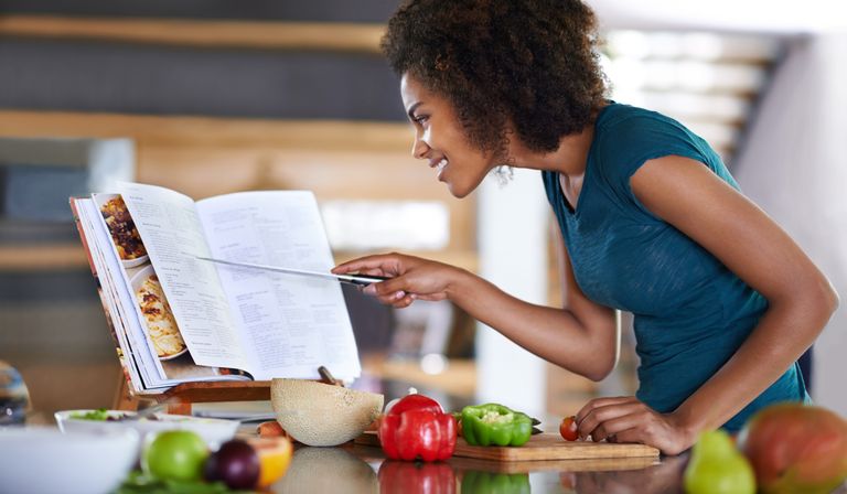 Woman uses one of the best vegan cookbooks