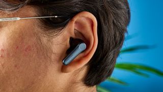 A photo of the EarFun Air Pro 4 earbuds in ear