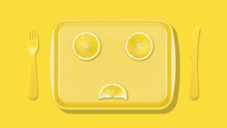 Illustration of a food tray with a sad face made of lemon slices