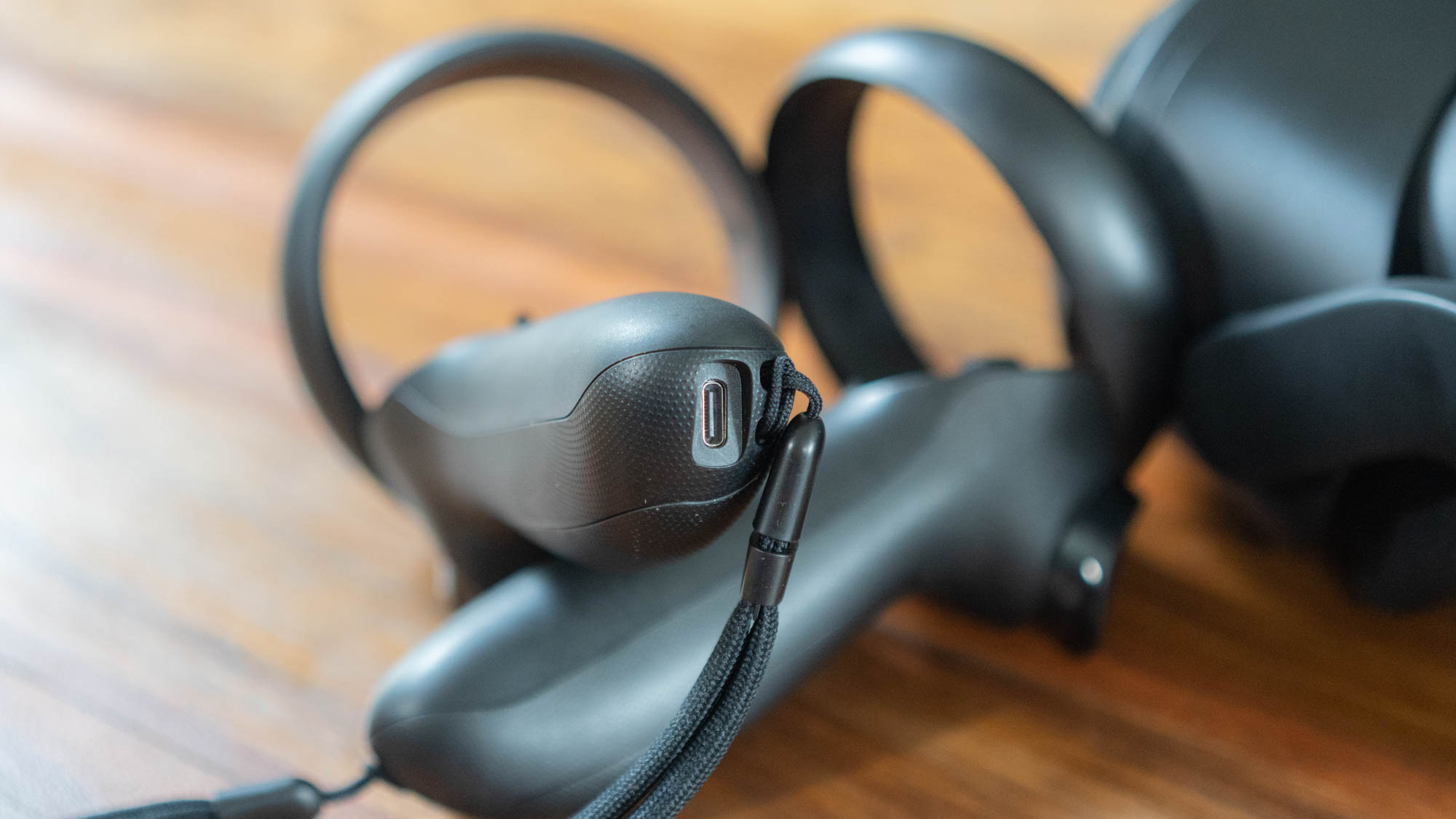 A closeup of the HTC Vive Focus 3 controller's charging port
