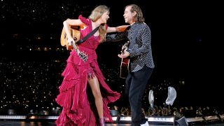 Taylor Swift and Aaron Dessner performing together in Tampa