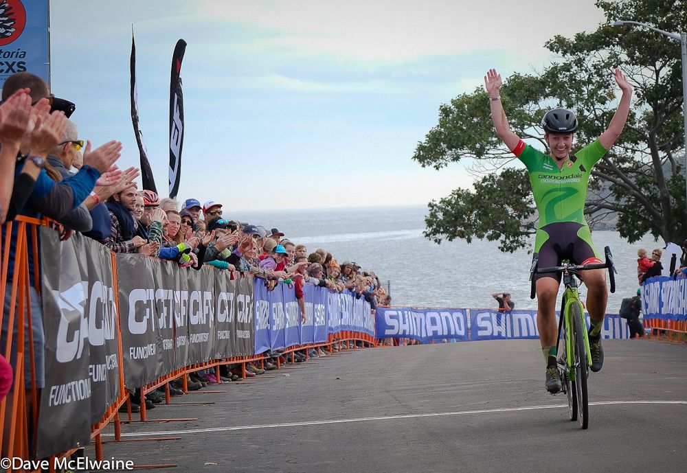 Emma White (Cannondale) crossing the line in front of a massive cheering crowd