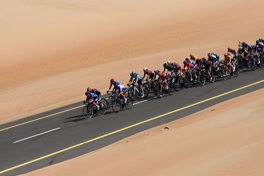 AL MIRFAUNITED ARAB EMIRATES FEBRUARY 10 A general view of the peloton passing through the desert during the 1st UAE Tour Women 2023 Stage 2 a 133km stage from Al Dhafra Castle to Al Mirfa UAETourWomen on February 10 2023 in Al Mirfa United Arab Emirates Photo by Tim de WaeleGetty Images